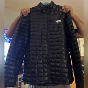 The North Face black men’s puffy coat
